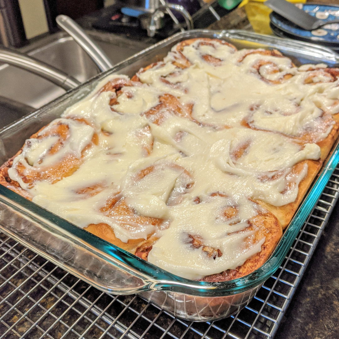 A tray of fresh baked cinnamon rolls