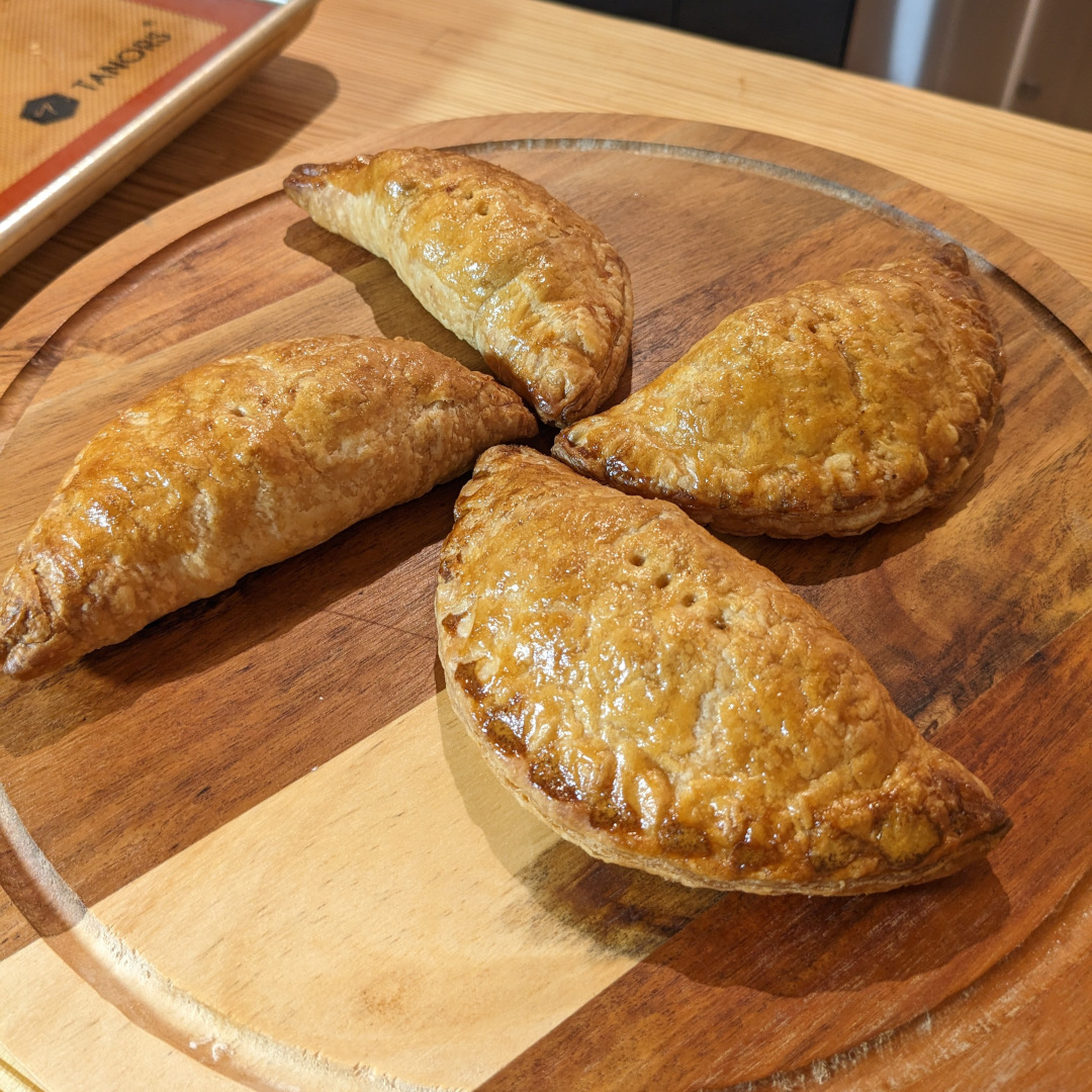 Moroccan hand pies on a cake plate