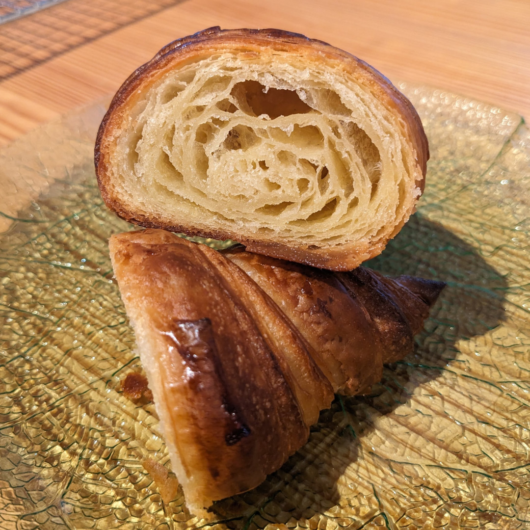 Close up view of a croissant cross-section showing off the honeycomb interior