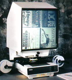 This looks almost exactly the way I remember the microfiche machine I used A microfiche machine displaying old newspaper ads
